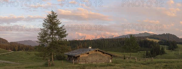 Wooden hut in the sunset