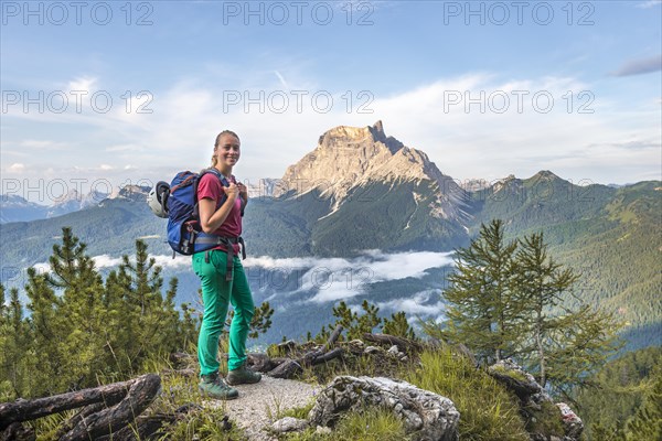 Young female hiker looks into the camera