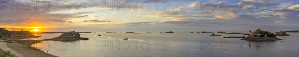 Sunset at Plage Tahiti and lighthouse on the Ile Louet and Chateau du Taureau