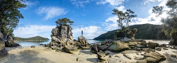 Young man standing on a rock
