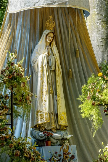 Statue of the Virgin Mary with golden crown of the Virgin Mary