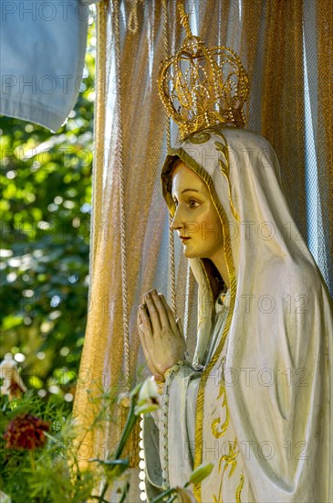 Statue of the Virgin Mary with golden crown of the Virgin Mary