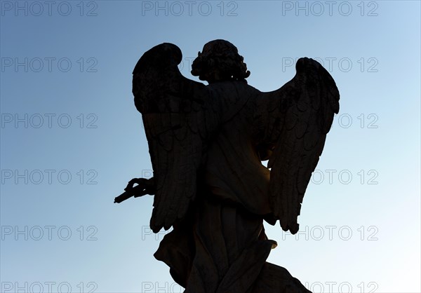 Silhouette of angel statue