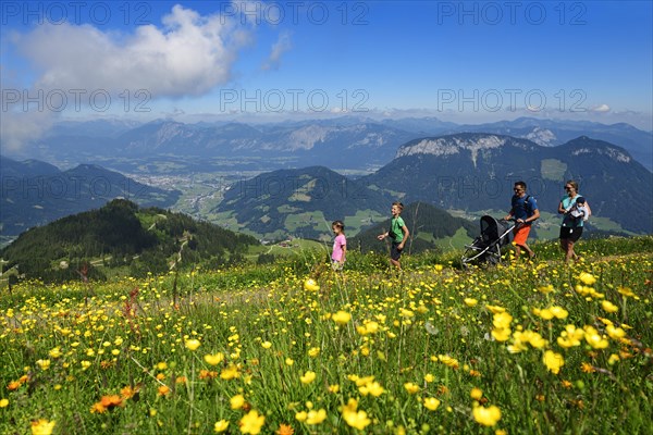 Family hiking on the summit panorama trail of the Hohe Salve