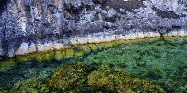 Formation of basalt stones on a steep coast at the Atlantic Ocean