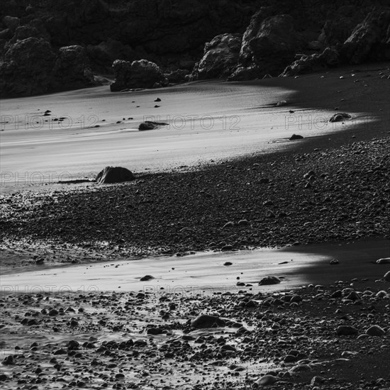 Water washes around stones