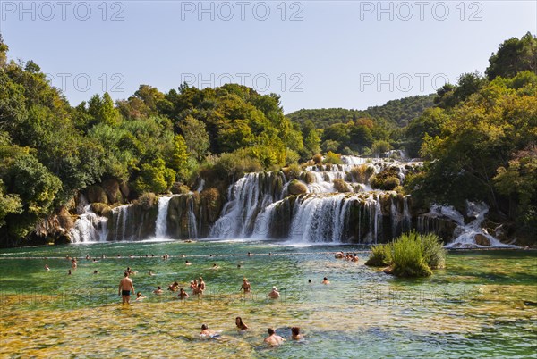 Tourists bathing at the Skradinski Buk waterfall