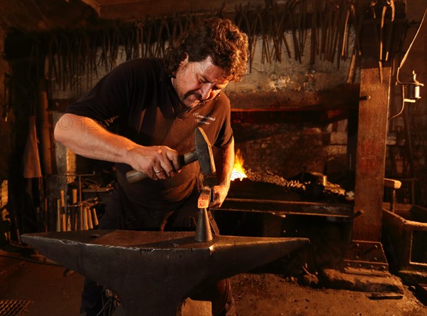 Blacksmith at the anvil