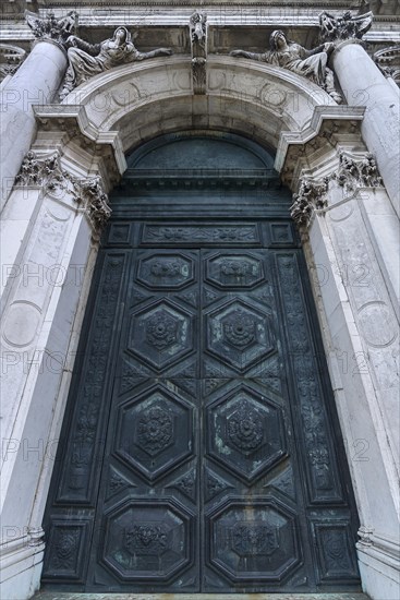 Upper entrance portal with the sybills of Cumae and Erythrai of the baroque church Santa Maria della Salute