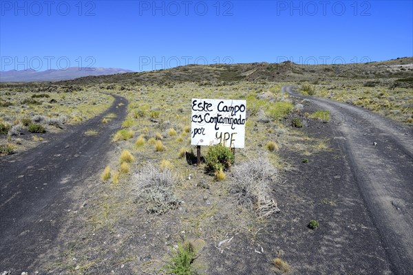 Runway with protest sign against oil company YPF