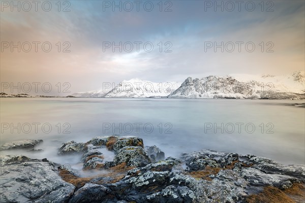 Coast of Gimsoy off snowy mountains