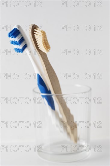 Wooden and plastic toothbrush in glabecher. Switzerland