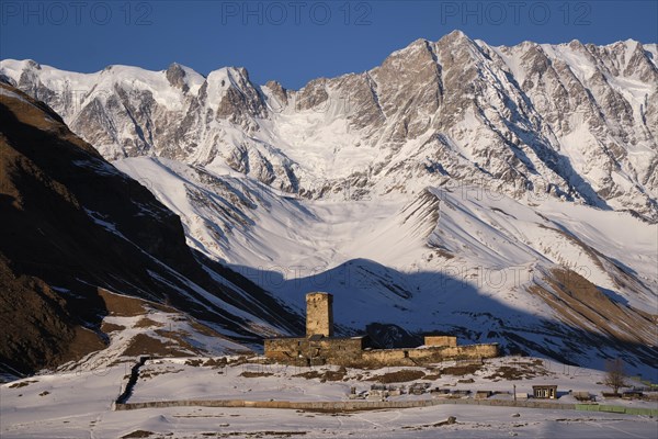 Watchtower in front of a mountain scenery