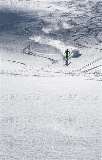 Skier with touring skis in deep snow
