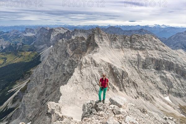 Woman standing on rocks and looking into the camera