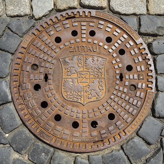 Manhole cover with coat of arms of Zittau