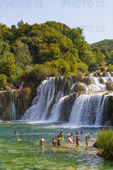 Tourists bathing at the Skradinski Buk waterfall