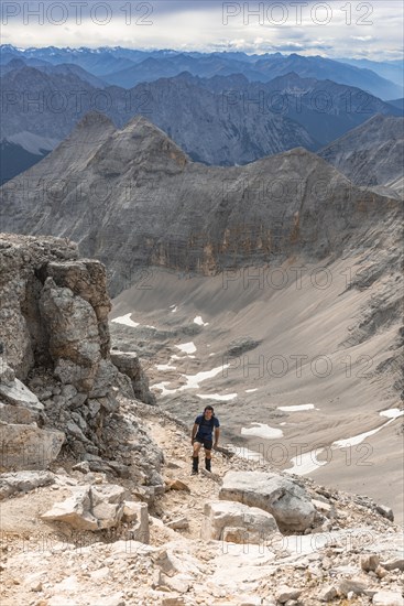 Hiker on hiking trail to the Birkkarspitze