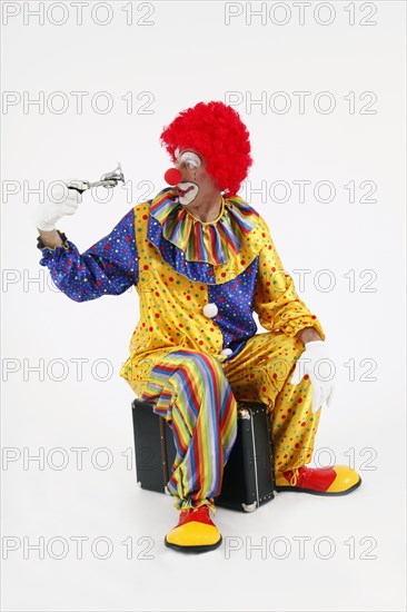 Clown with suitcase