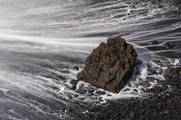 Water washes around stones