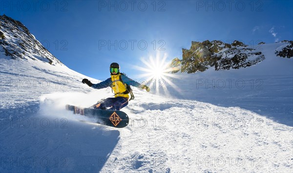 Snowboarder with splitboard rides in the snow