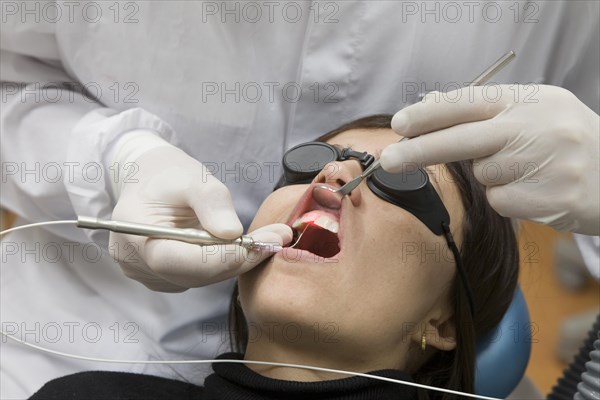 Dental treatment with laser