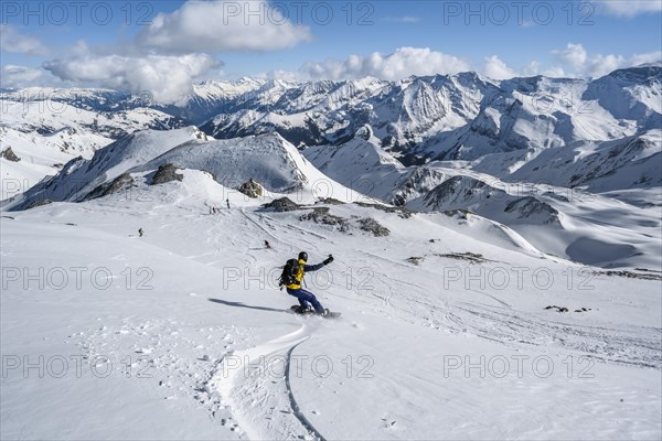 Snowboarder with splitboard rides in the snow