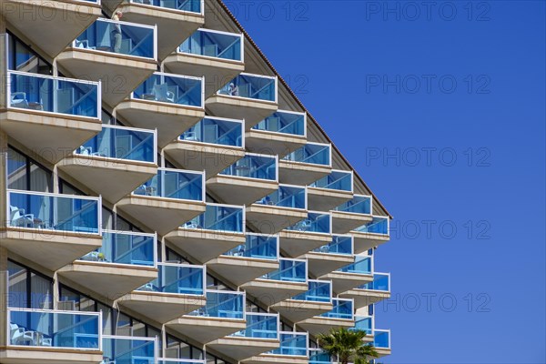 Balconies with blue glass railings at Hotel Cactus