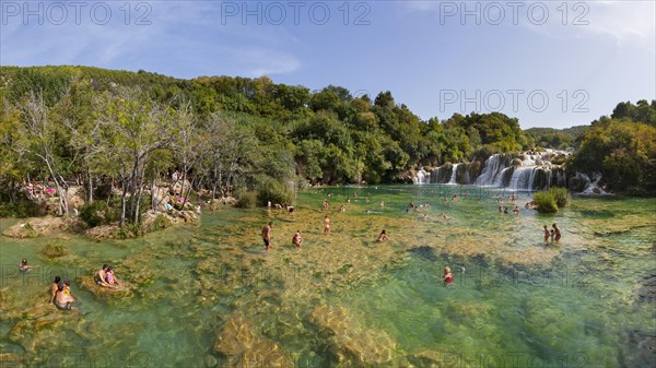 Tourists bathing at the Skradinski Buk waterfall