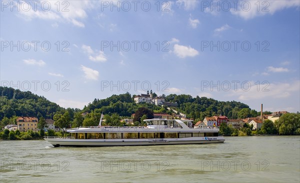 Excursion boat on the Inn with pilgrimage church Mariahilf