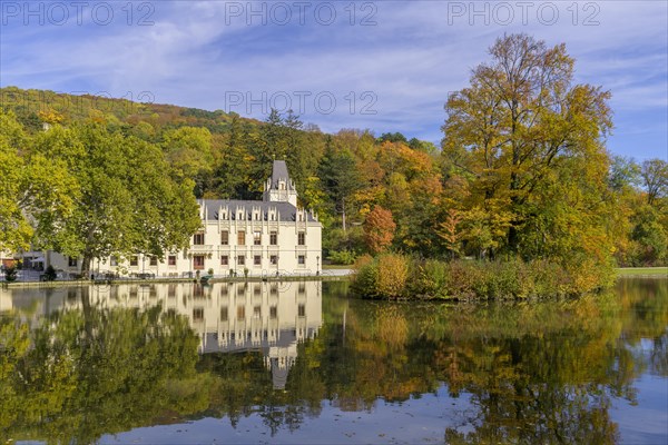 Castle Hernstein with pond with beautiful autumn colours in the park