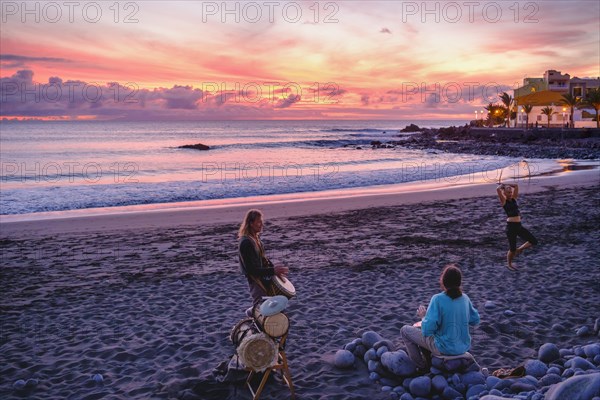Drummers on the beach of La Playa at dusk