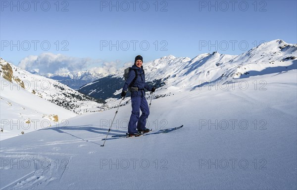 Ski tourer in the snow