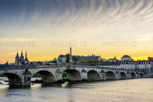 View on bridge Jacques Gabriel and the town of Blois at sunset
