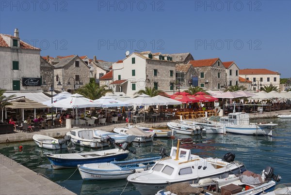 Promenade with fishing boats in the port