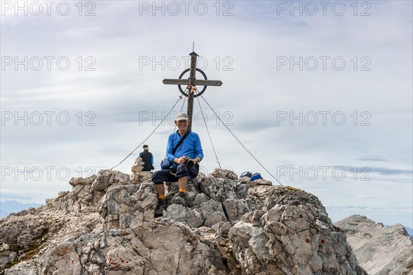 Hiker takes a break at the Birkkarspitze