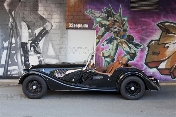 Morgan Plus 4 in front of Graffiti