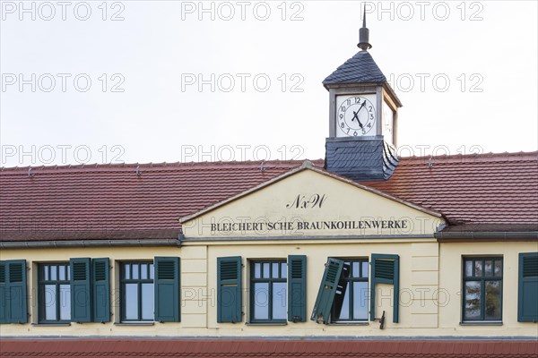 Facade with tower clock and inscription Bleichertsche Braunkohlenwerke