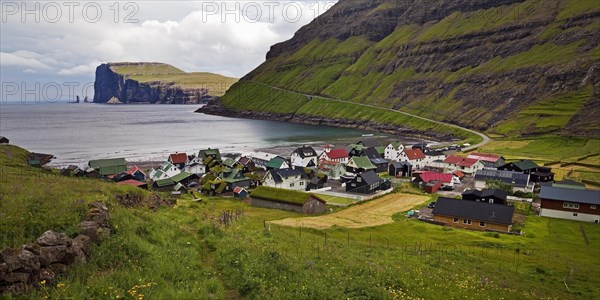 The small village of Tjornuvik with view of the Atlantic Ocean