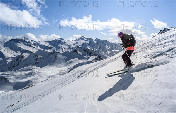 Snowboarder with splitboard rides in the snow