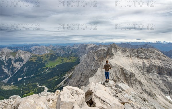 Hiker at the summit of the Birkkarspitze