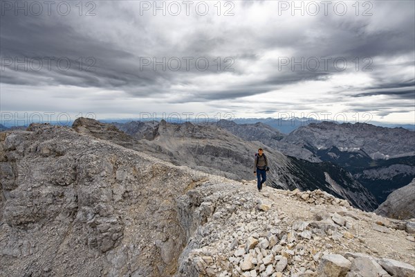 Mountaineer on the summit of the western Oedkarspitze
