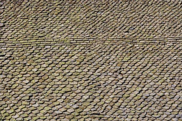 Church roof covered with stone tiles