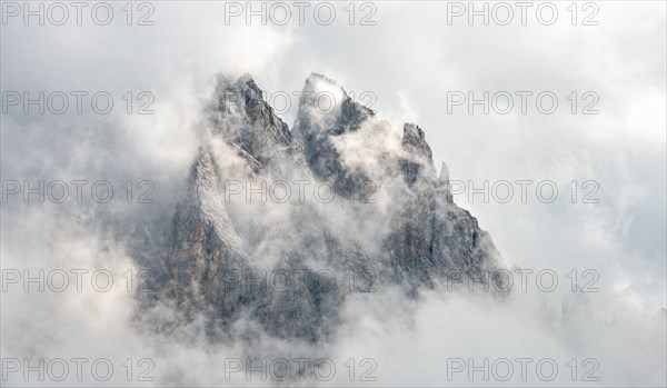 Cloud-covered rocky peaks