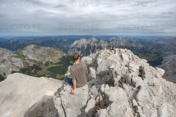 Hikers sitting on the summit of the Birkkarspitze