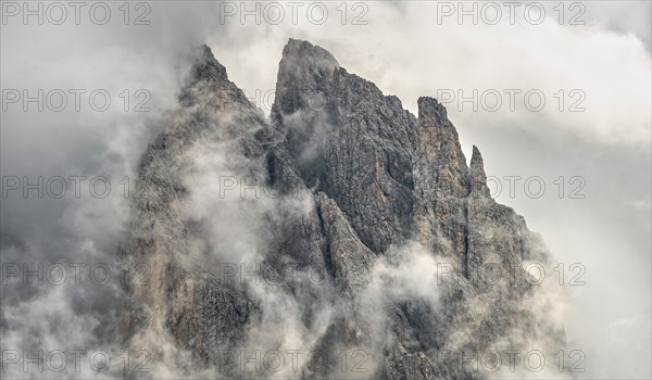 Cloud-covered rocky peaks