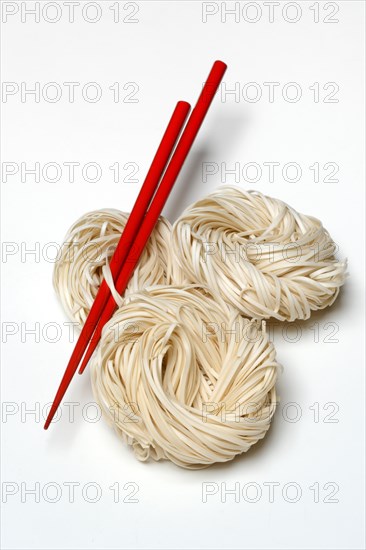 Asian nest noodles with red chopsticks