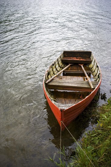 Red rowing boat on the banks of the Erlaufsee near Mariazell