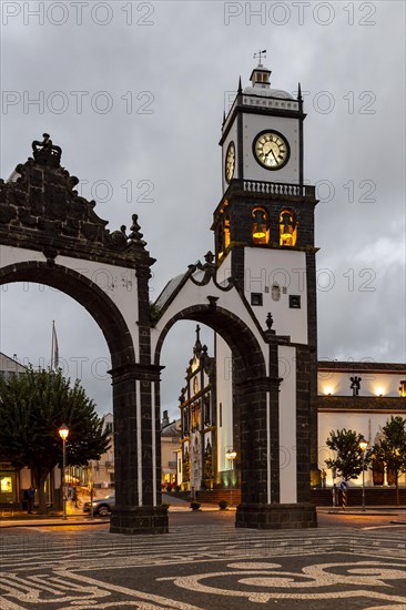 Portas da Cidade gates with the church of St. Sebastian in the evening