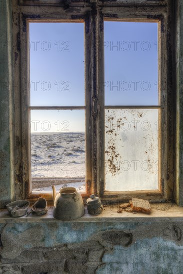 Window in the ruins of a residential building